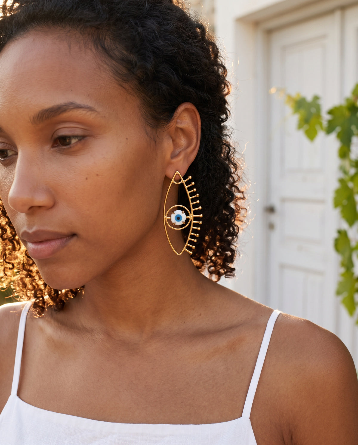 evil eye assymetrical earrings