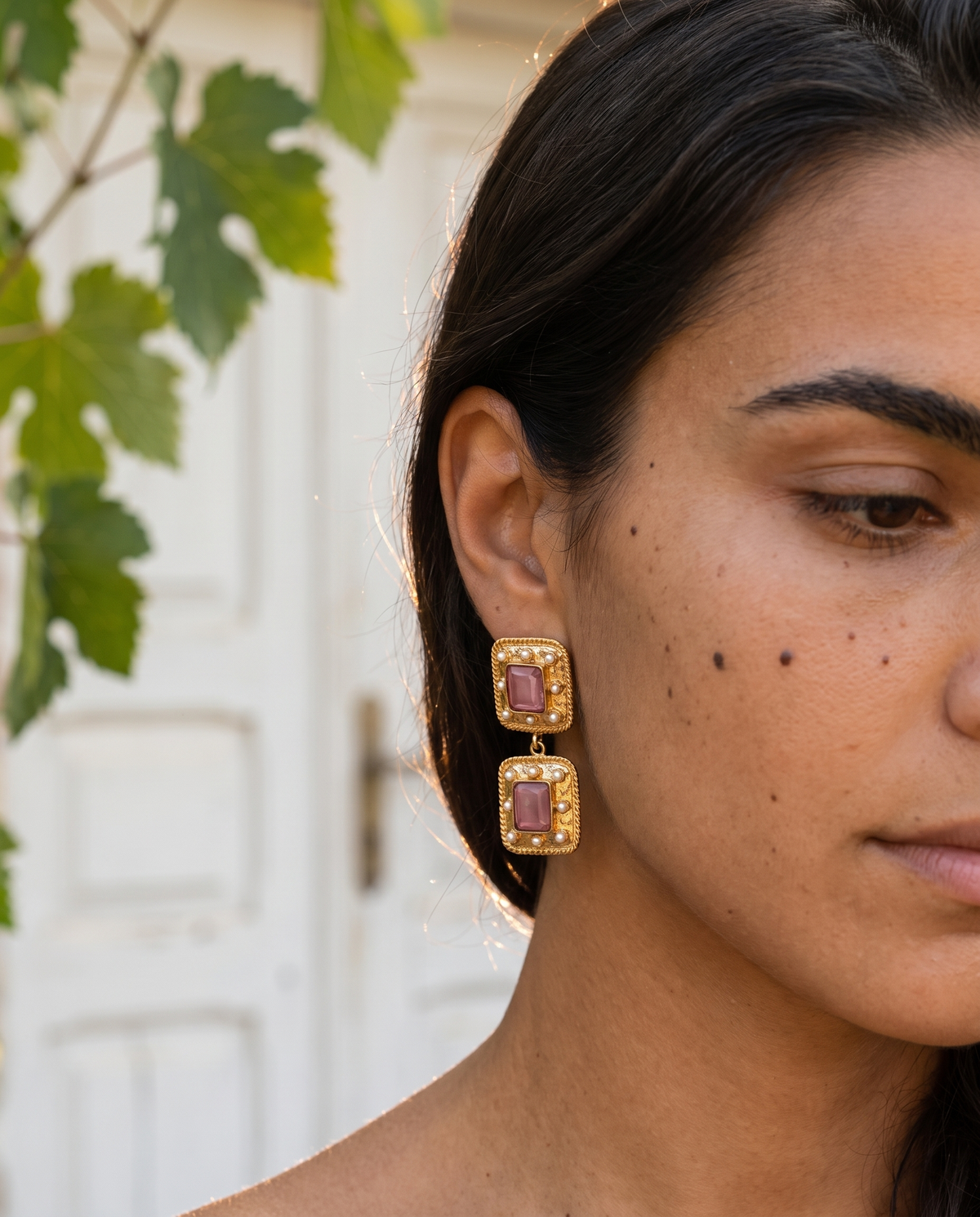 gold statement earrings with square pink gemstones