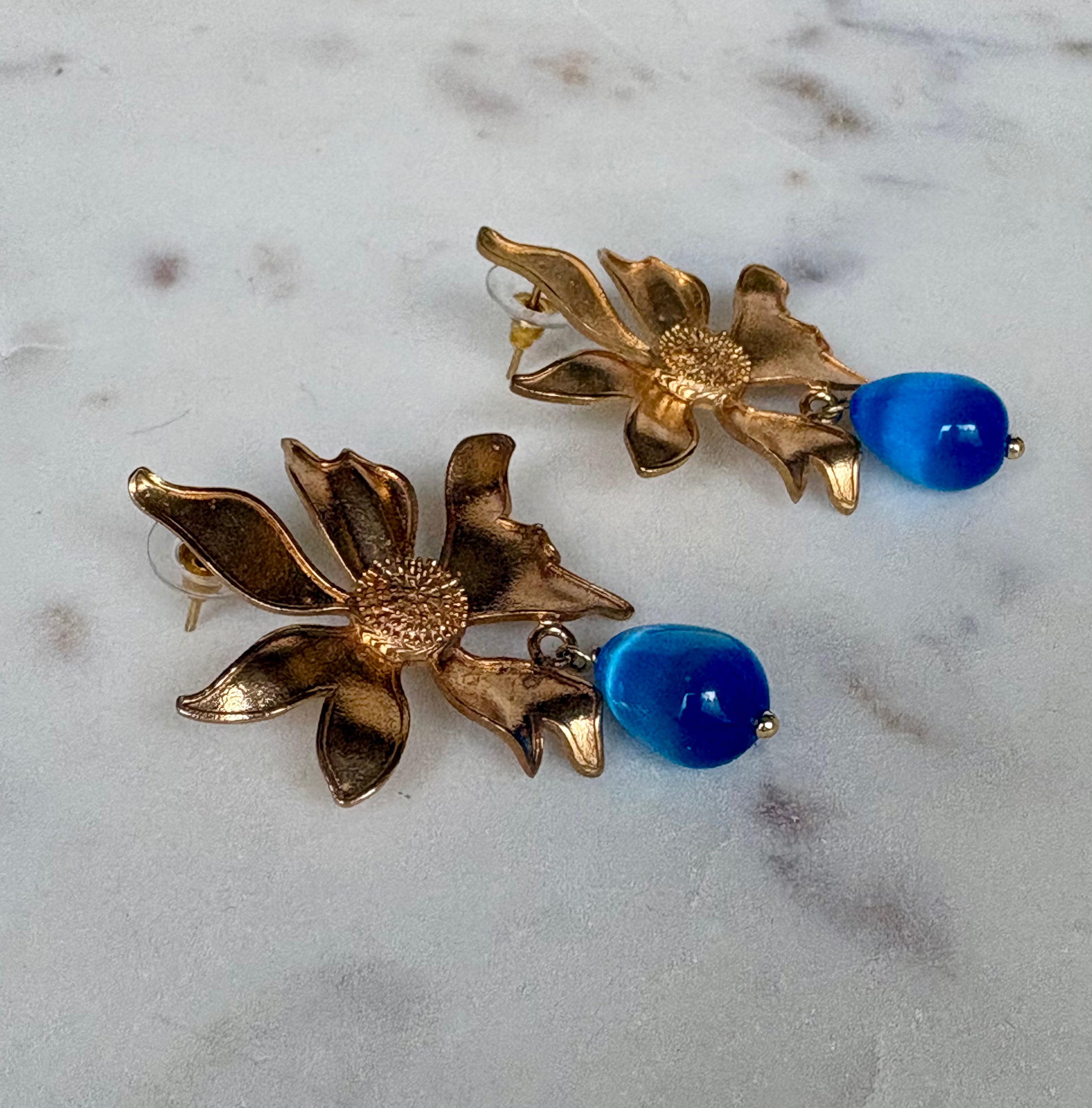 gold flower earrings with blue drop