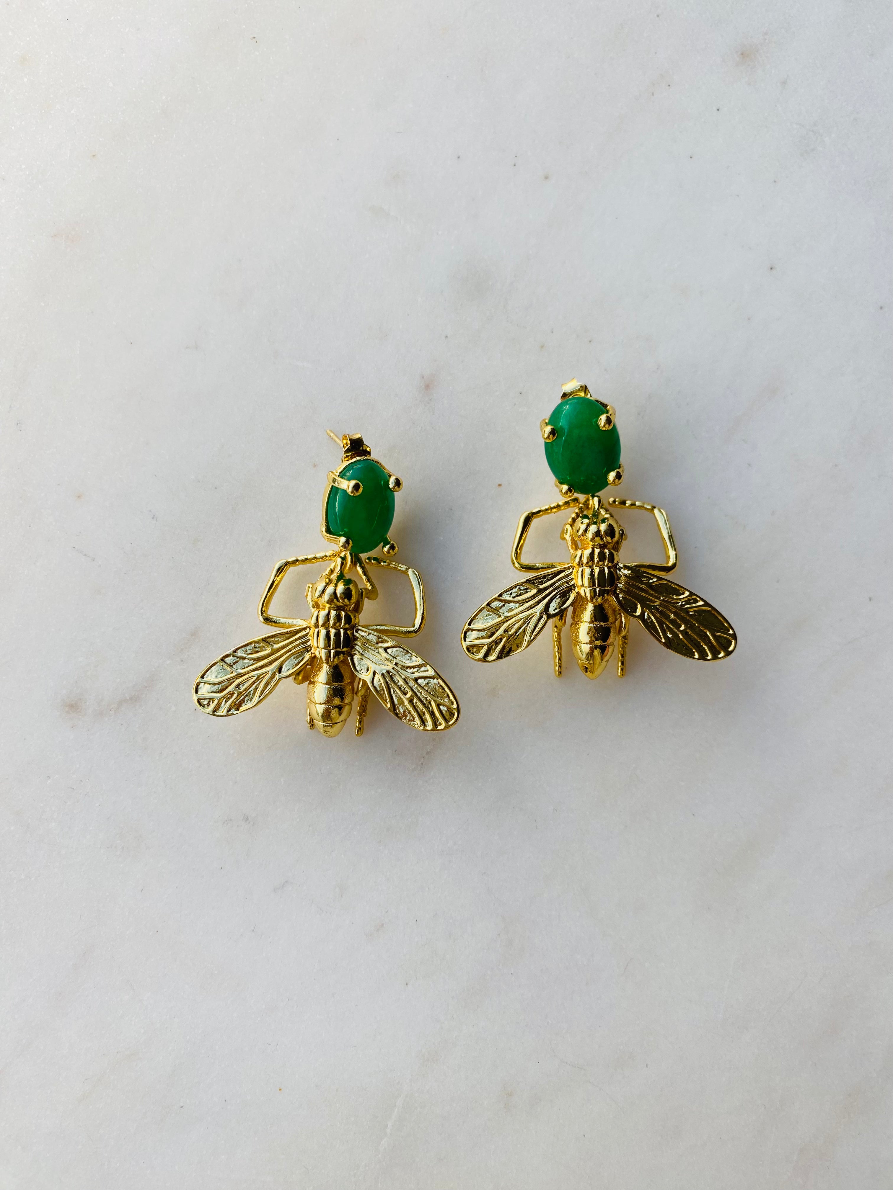 gold insect earrings emerald green gemstone
