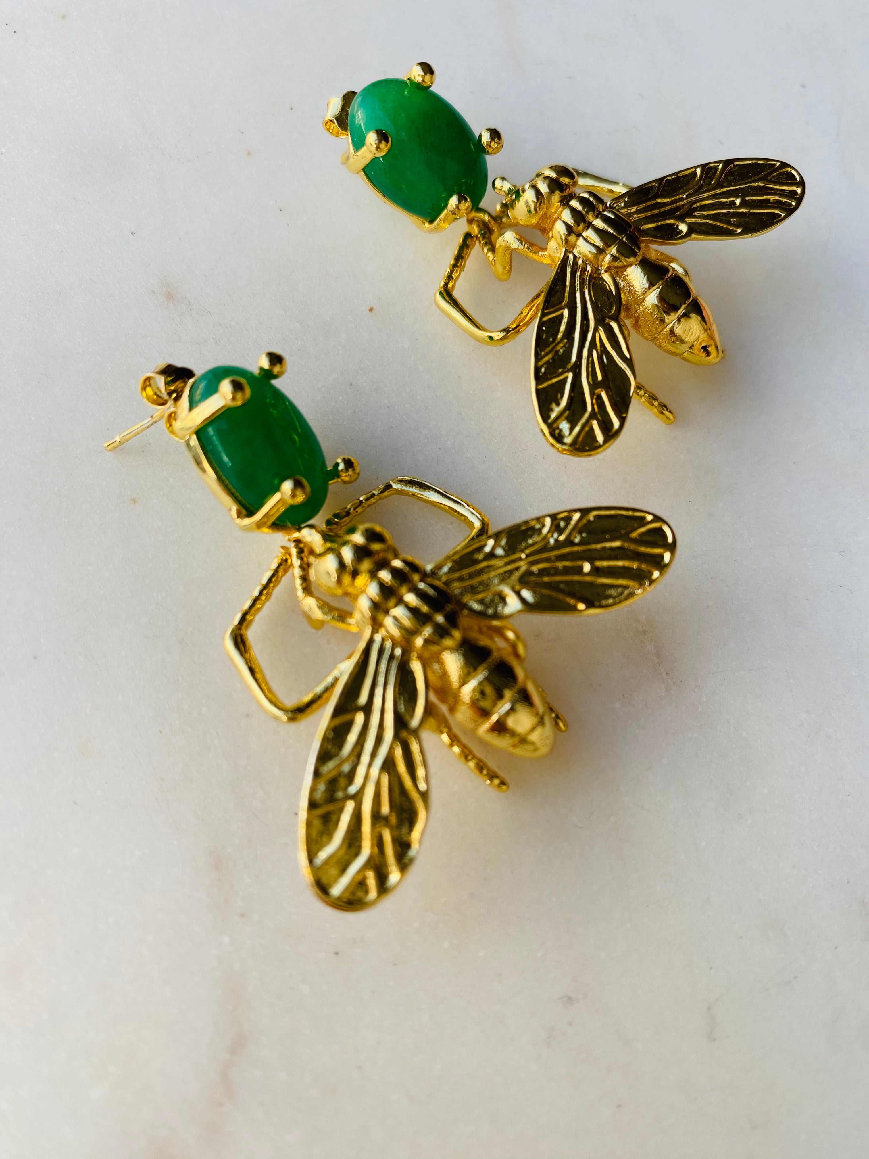 gold insect earrings emerald green gemstone