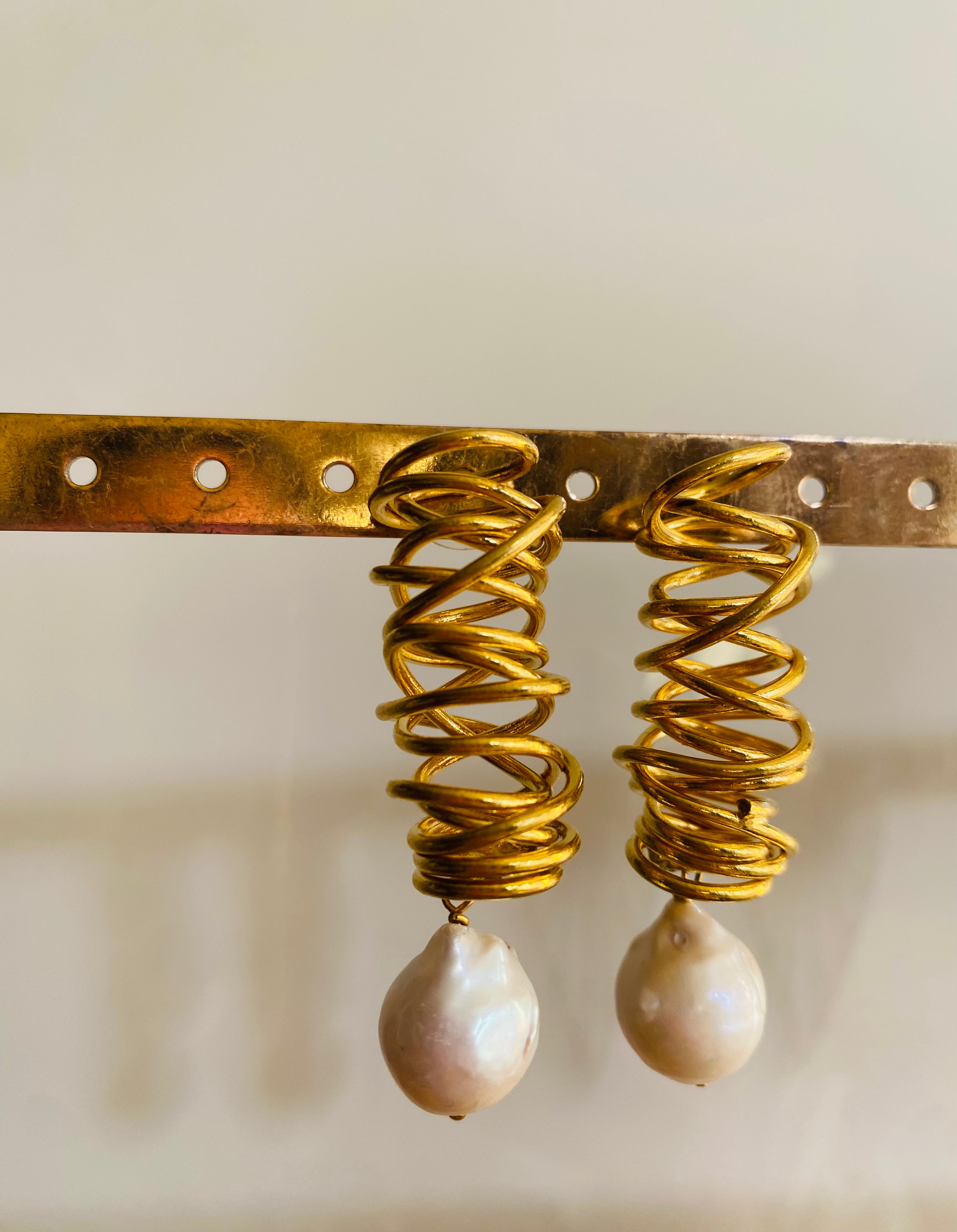 golden whirlwind pearl drop earrings