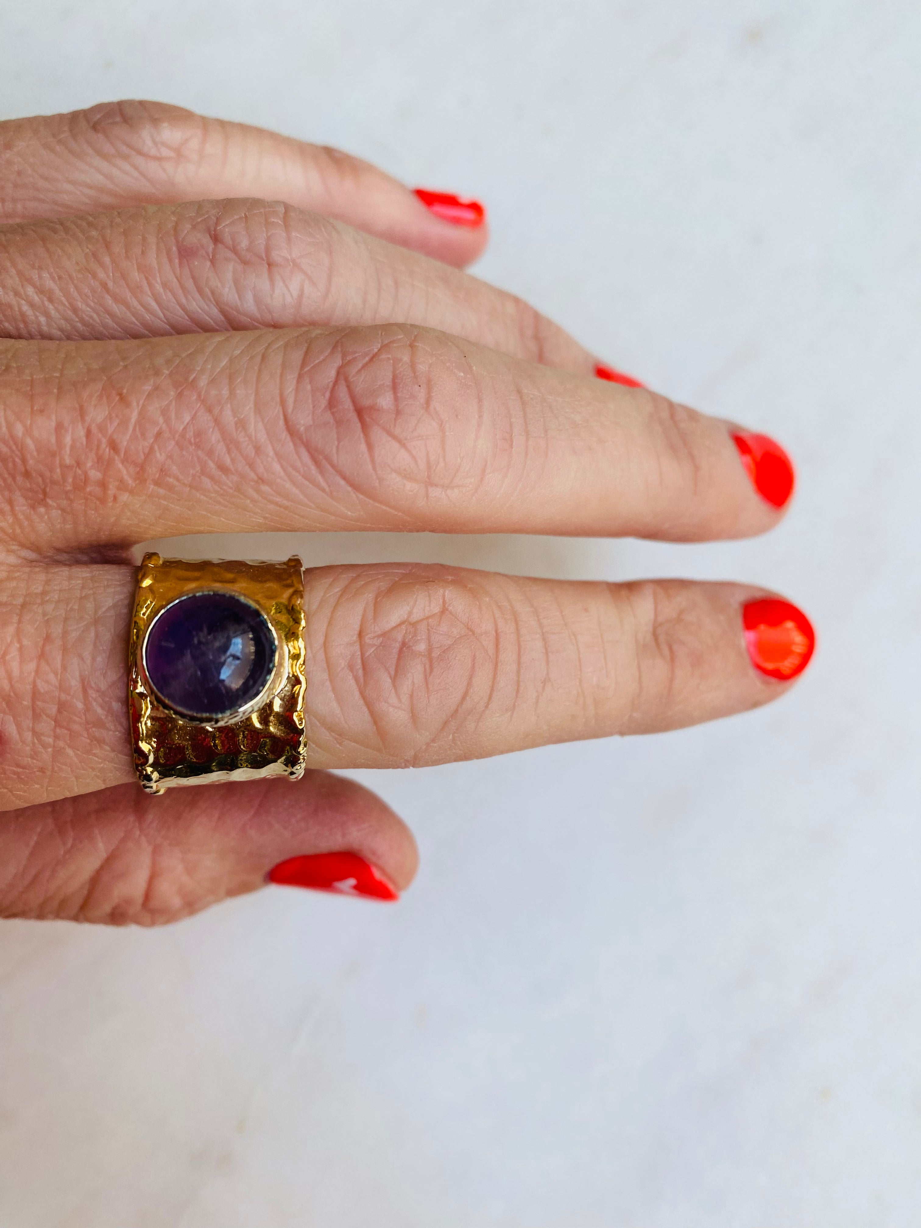purple stone gold band ring