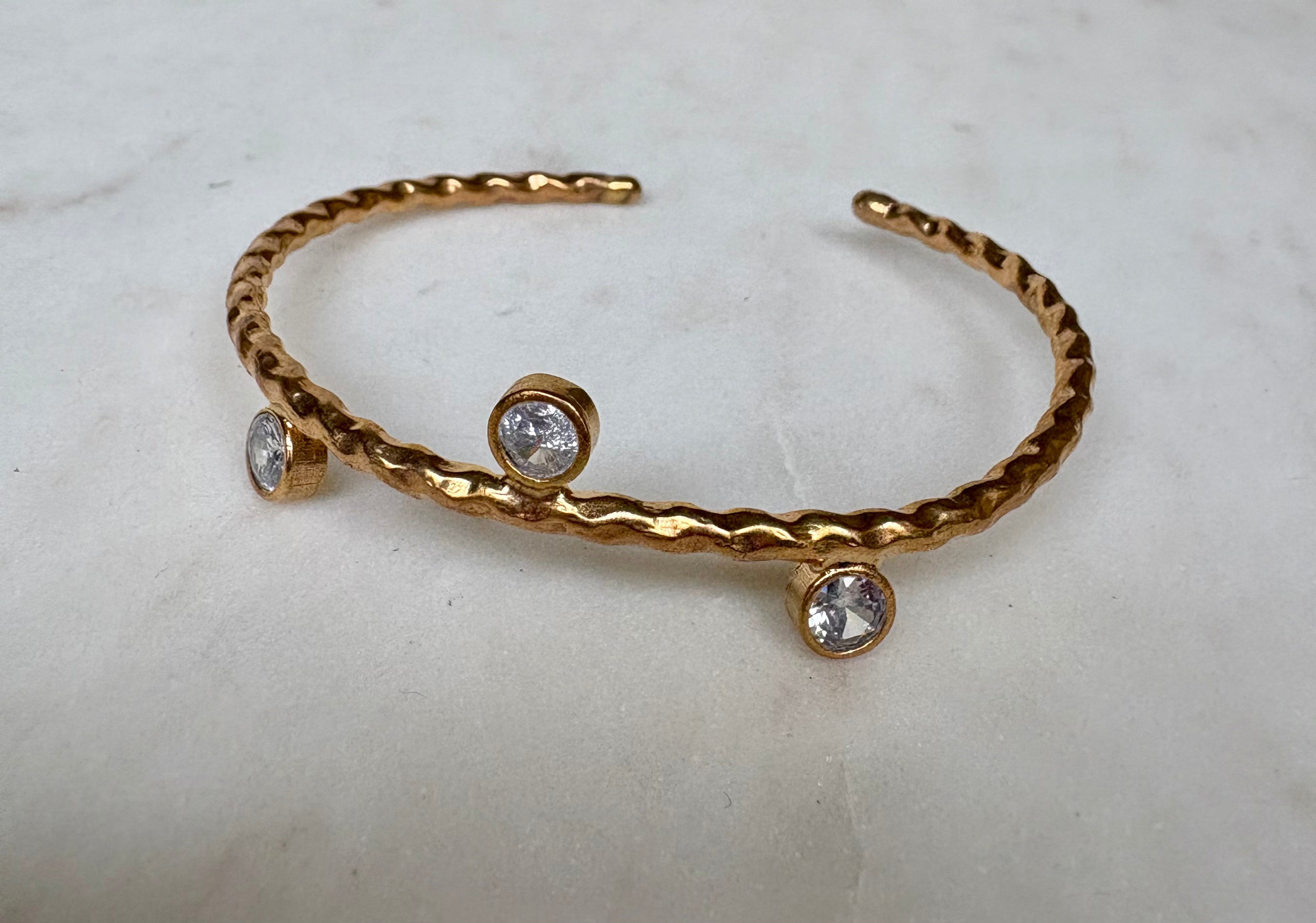 Twisted Open Bangle in Gold Zircon Detail