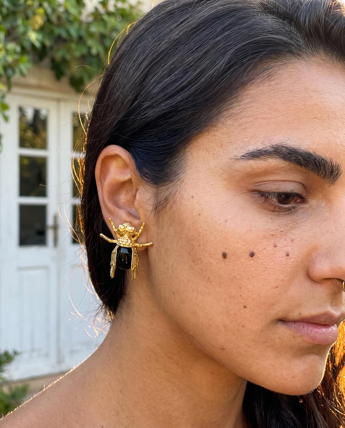 insect black gemstone earrings