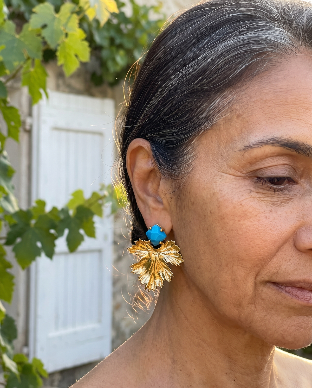sky blue gemstone gold leaf design earrings
