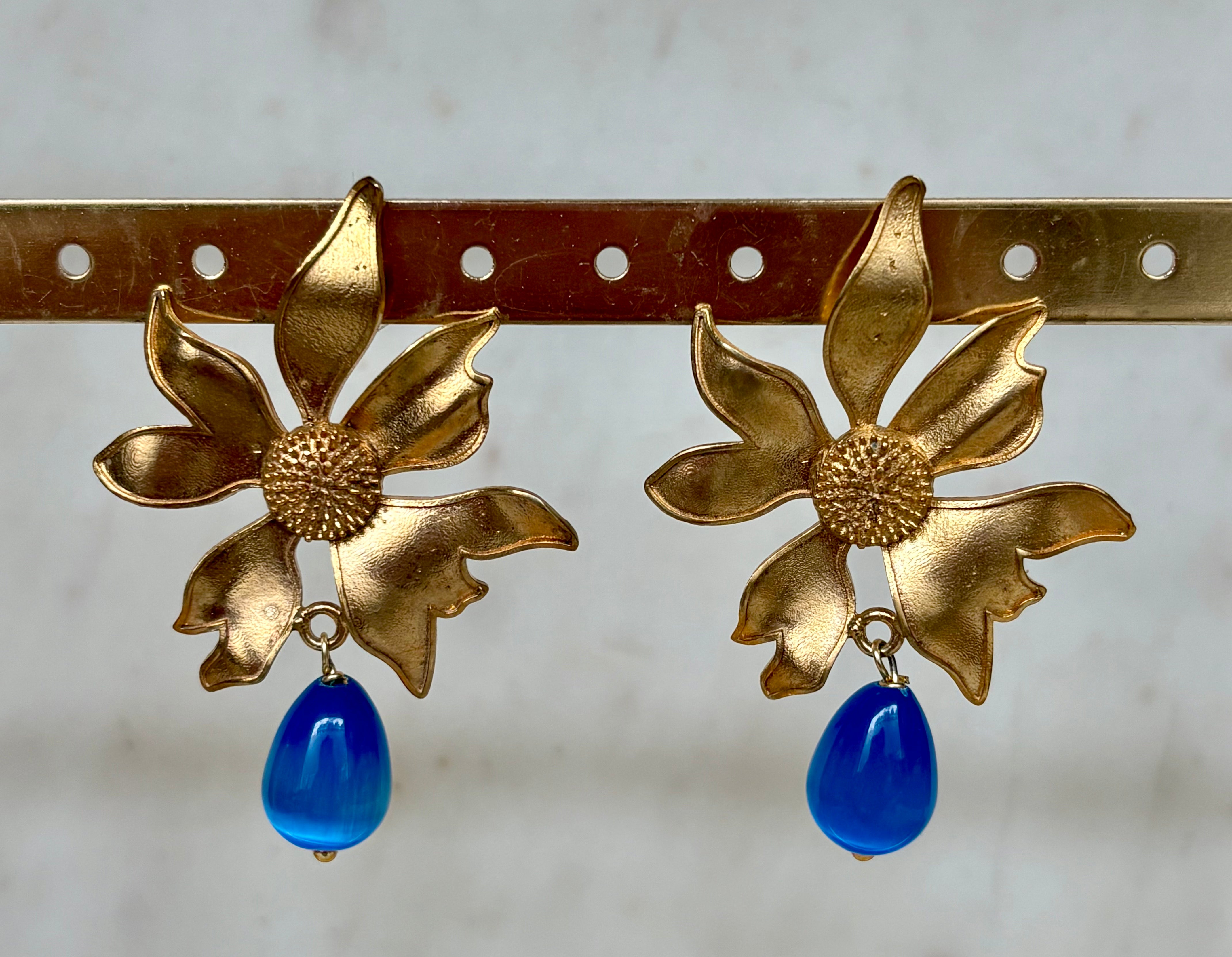 gold flower earrings with blue drop