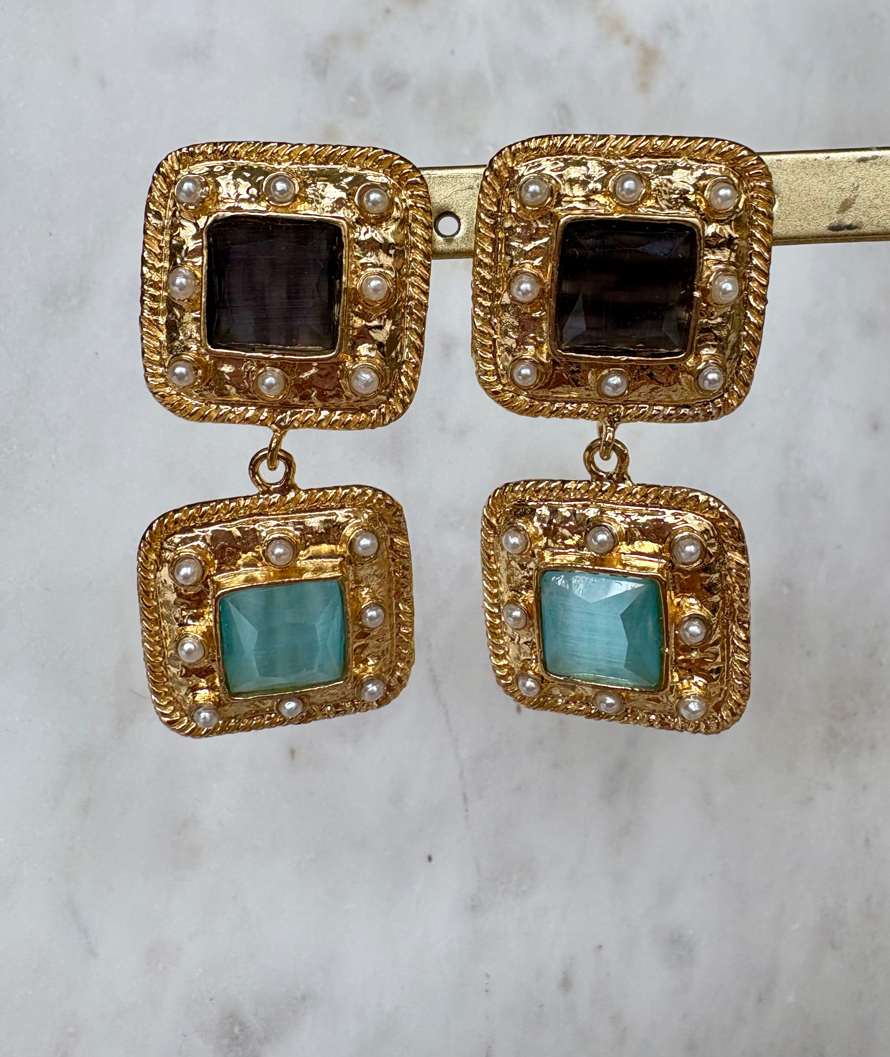 black light blue gemstone statement earrings
