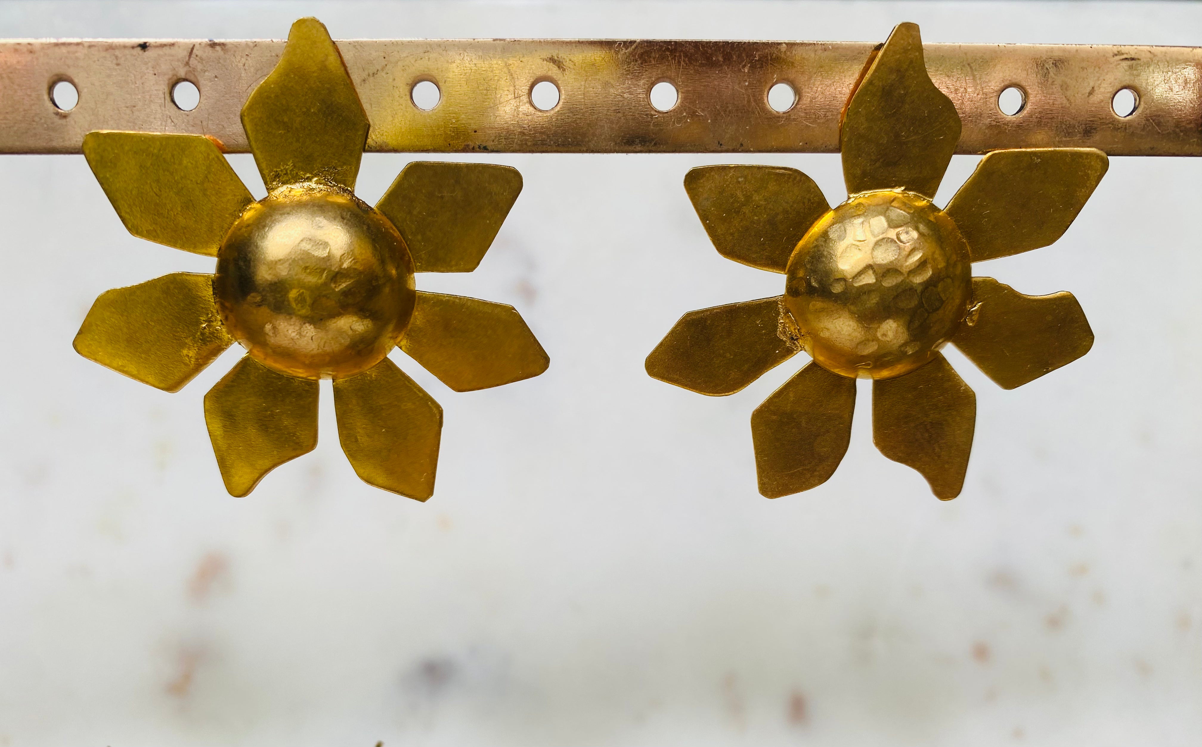 sun shaped golden earrings
