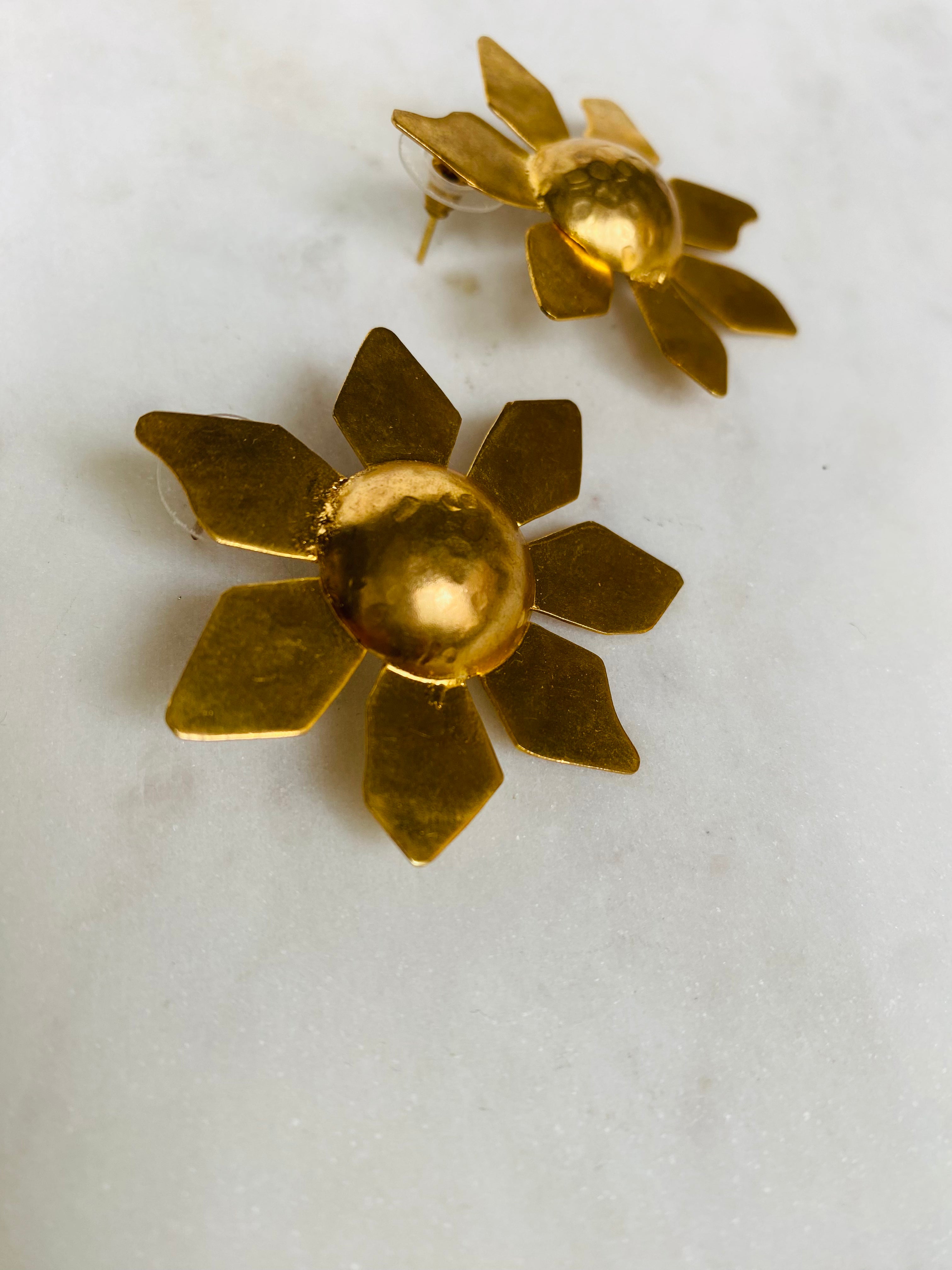 sun shaped golden earrings