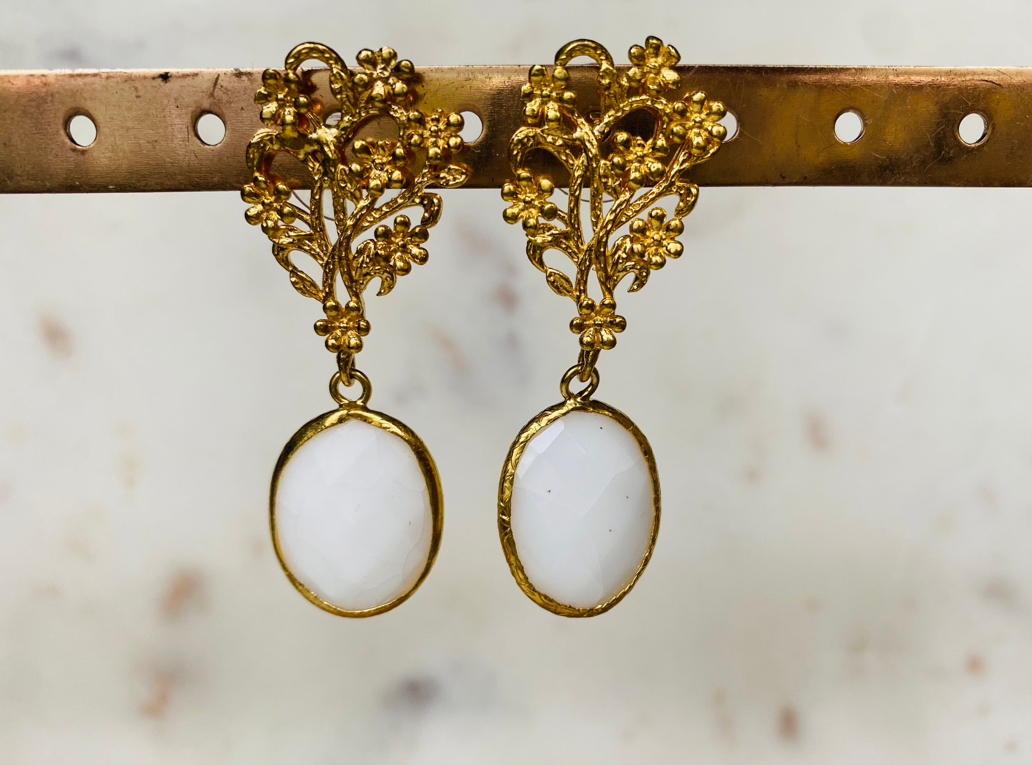 white gemstone design earrings